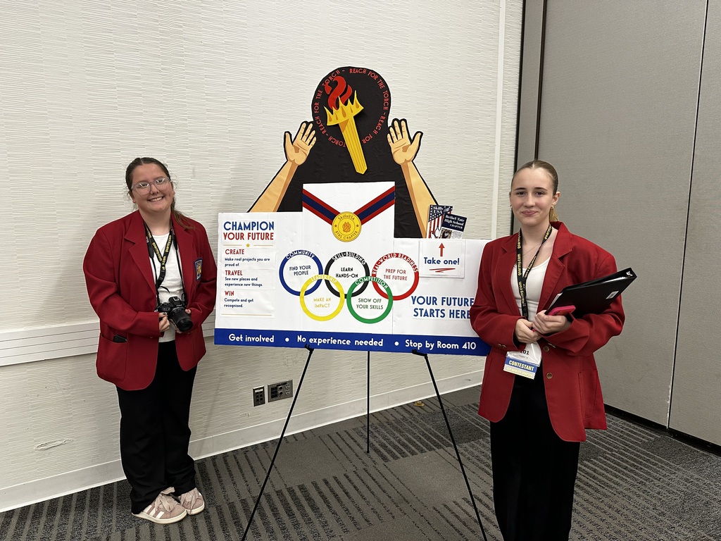 2 students by a sign