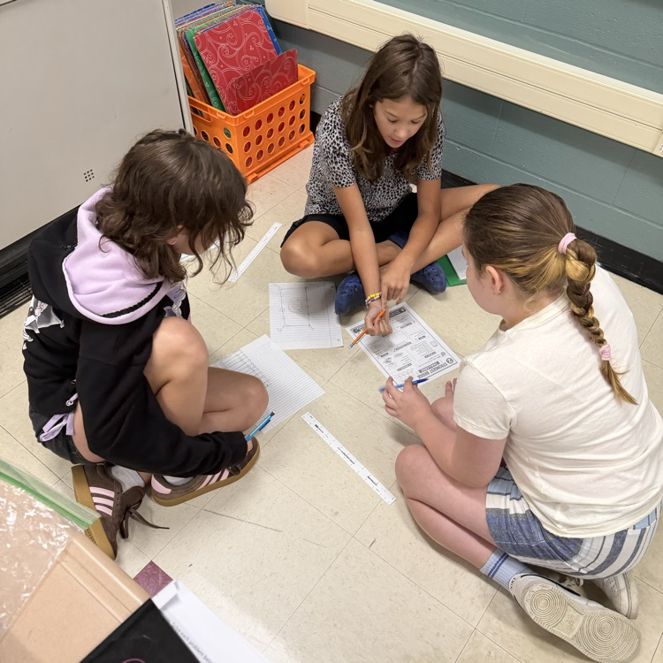 Mrs. Senger’s sixth graders designing bridges with marshmallows and toothpicks to see which holds the most weight.