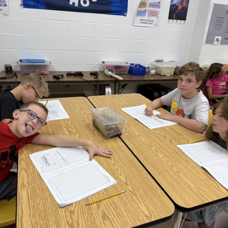 Students are learning about Earth’s water and interconnected systems by building terrariums that contain all four of Earth’s systems. 