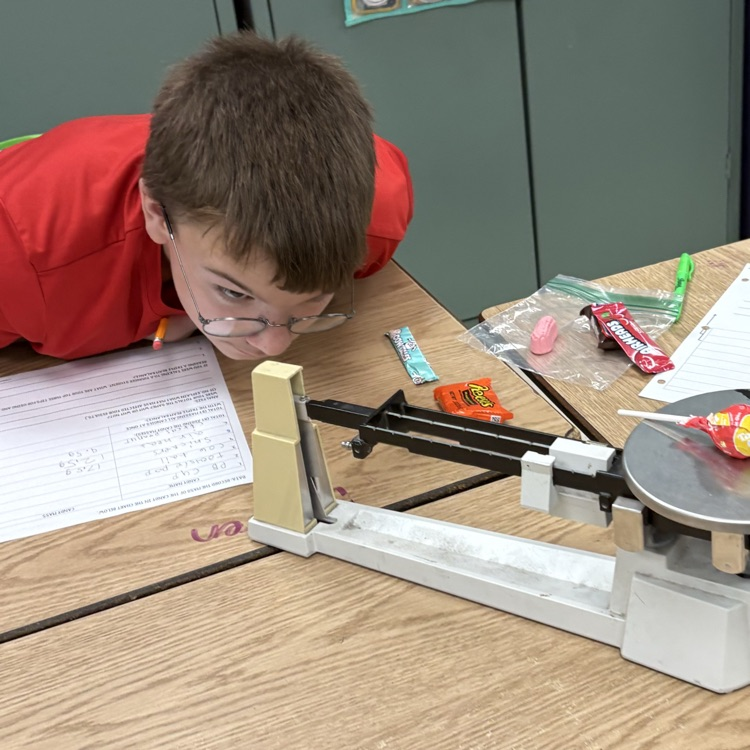 7th graders practiced using and reading a triple beam balance today while measuring the mass of different candies.