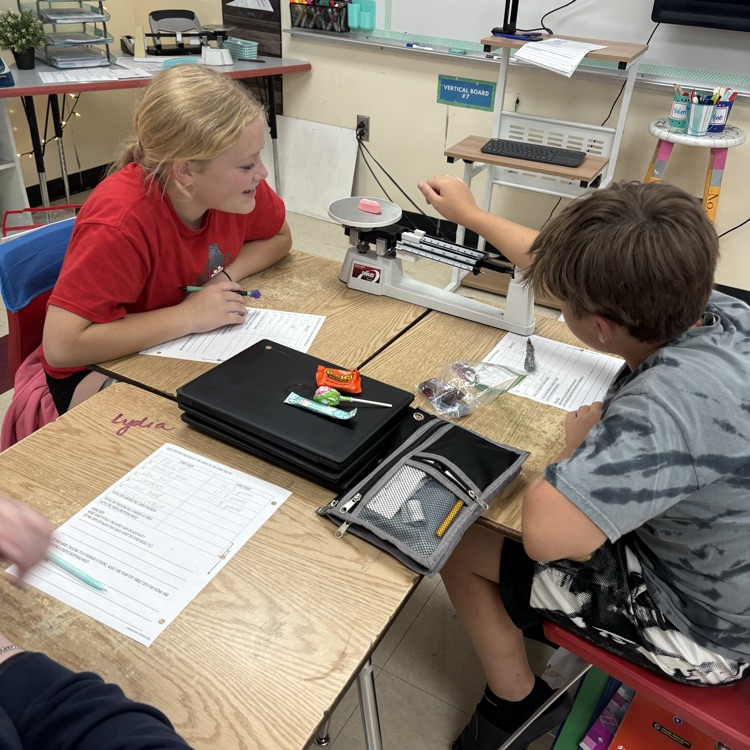 7th graders practiced using and reading a triple beam balance today while measuring the mass of different candies.