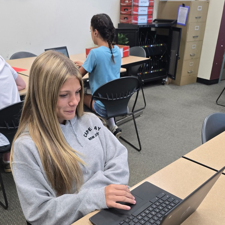 8th graders in Career Exploration set up their slides for the presentation they will be giving on a job they research.