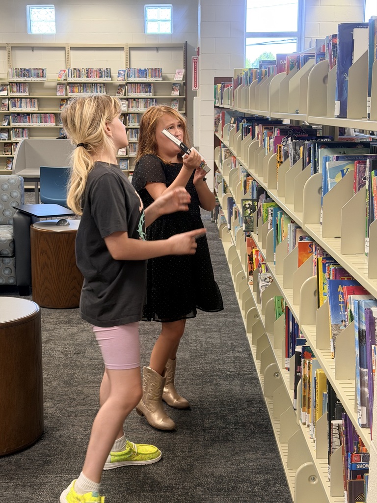 Students visit the public library to choose the perfect books to read and recommend to peers.