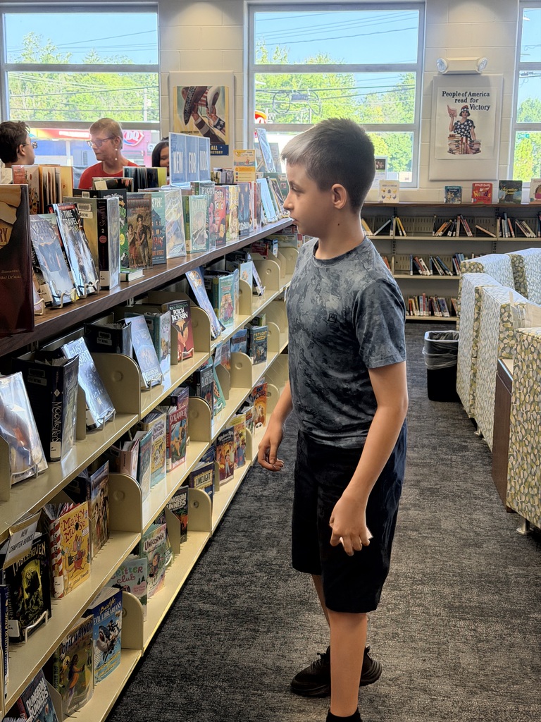 Students visit the public library to choose the perfect books to read and recommend to peers.