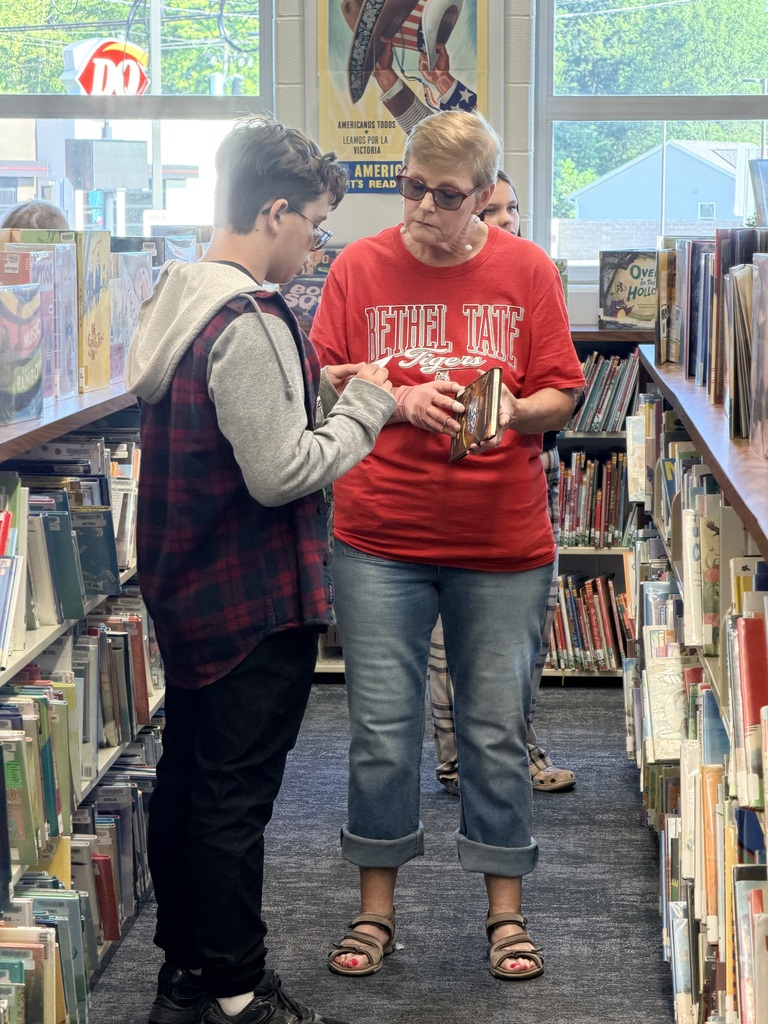Students visit the public library to choose the perfect books to read and recommend to peers.