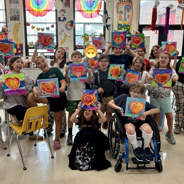 5th graders showing off their Warm and Cool Colors Heart project, in Art class.  What a fun bunch of kids!!