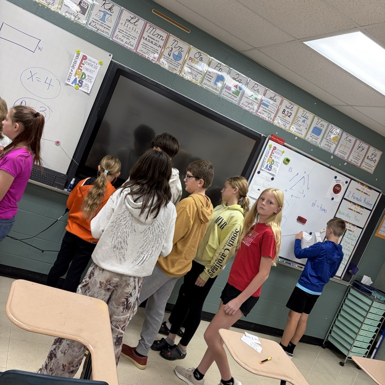 Students were solving algebraic equations and placing the final answer on the number line in the spot it should be on and why.