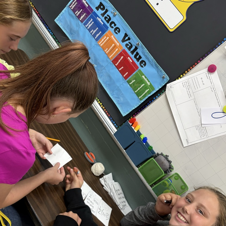 Students were solving algebraic equations and placing the final answer on the number line in the spot it should be on and why.