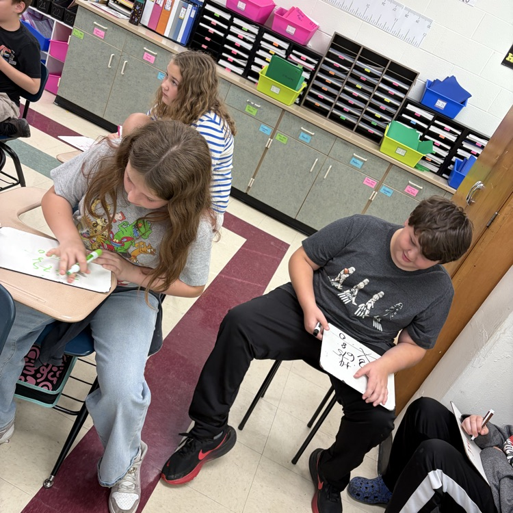 5th graders playing math jeopardy to review for their unit test 