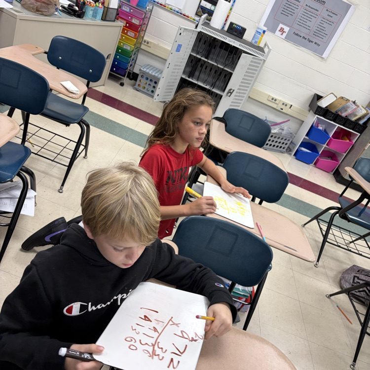 5th graders playing math jeopardy to review for their unit test 