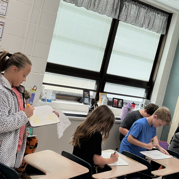 5th graders playing math jeopardy to review for their unit test 