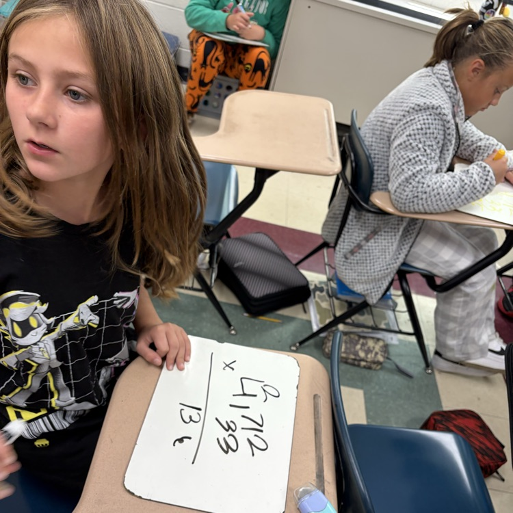 5th graders playing math jeopardy to review for their unit test 