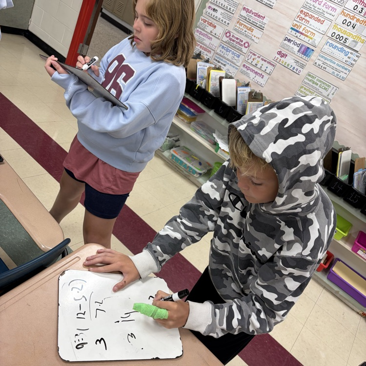 6th graders playing math jeopardy to review for their unit test 