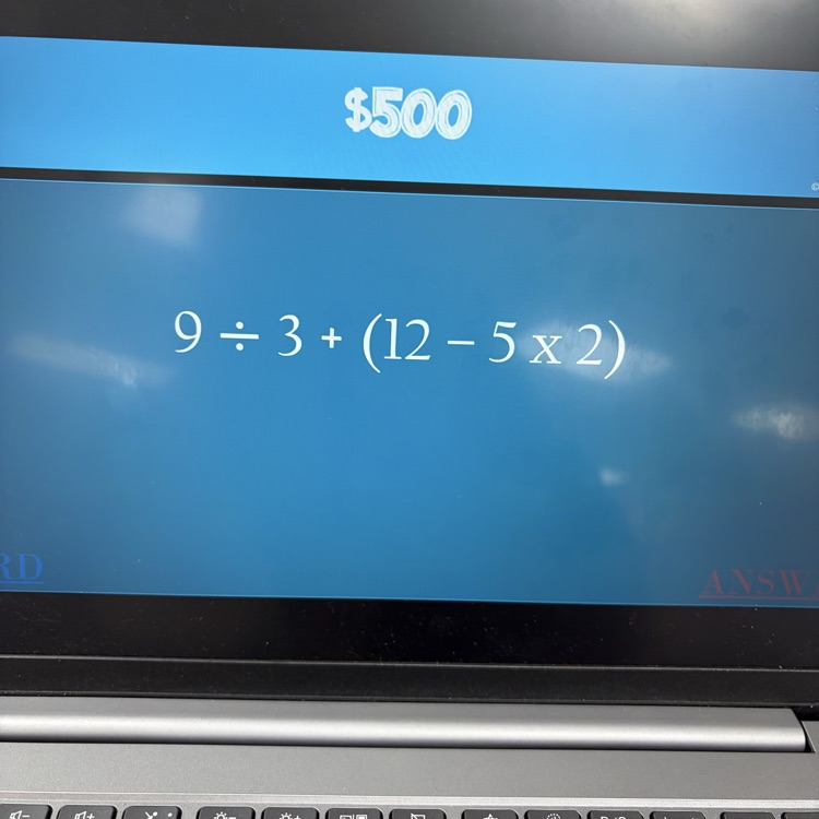 6th graders playing math jeopardy to review for their unit test 