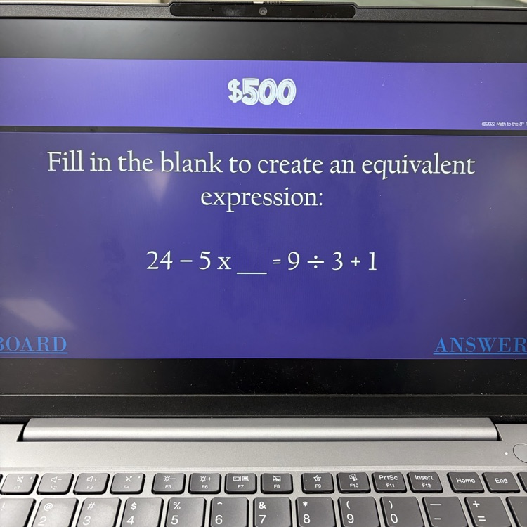 6th graders playing math jeopardy to review for their unit test 