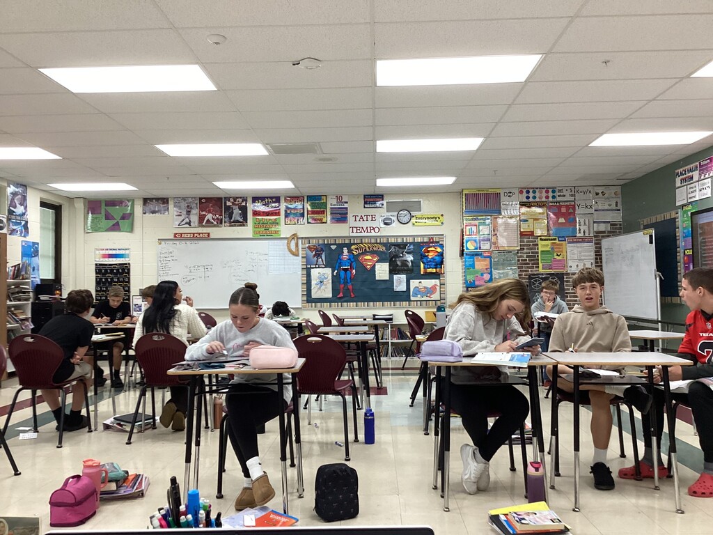 Mr. Essig’s math class completing their Module 3 Review in small groups.