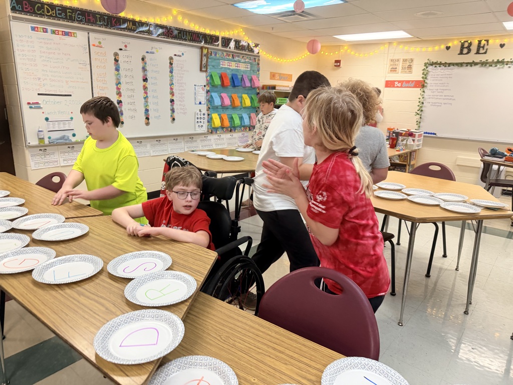 Students challenge other teams in paper plate races to study for a test. 