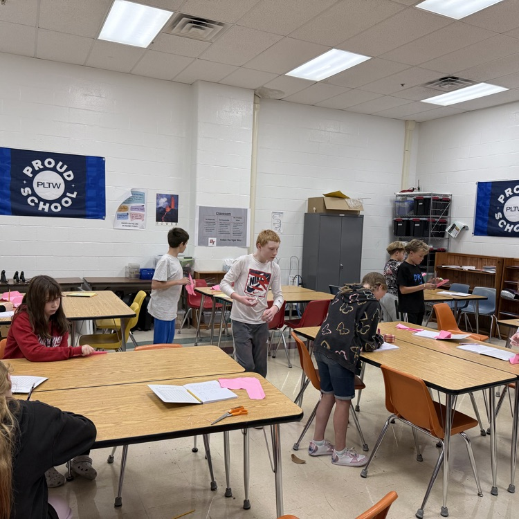 Students are having fun designing, building, and testing their paper airplane gliders! 