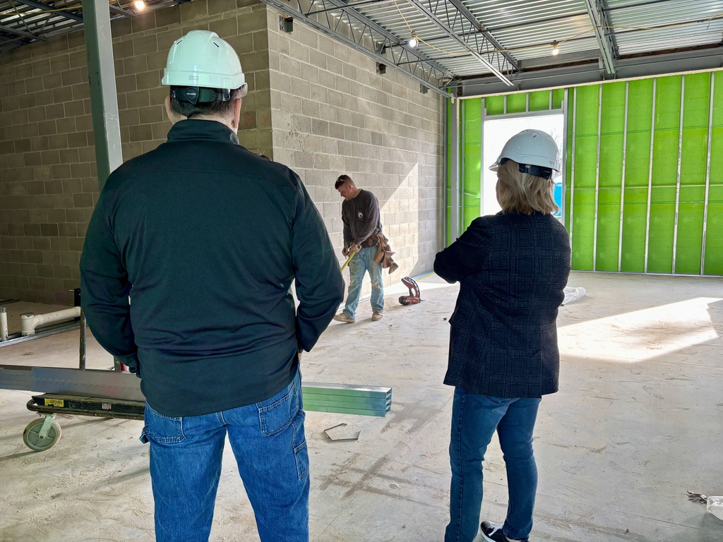 Legislator touring of construction work.