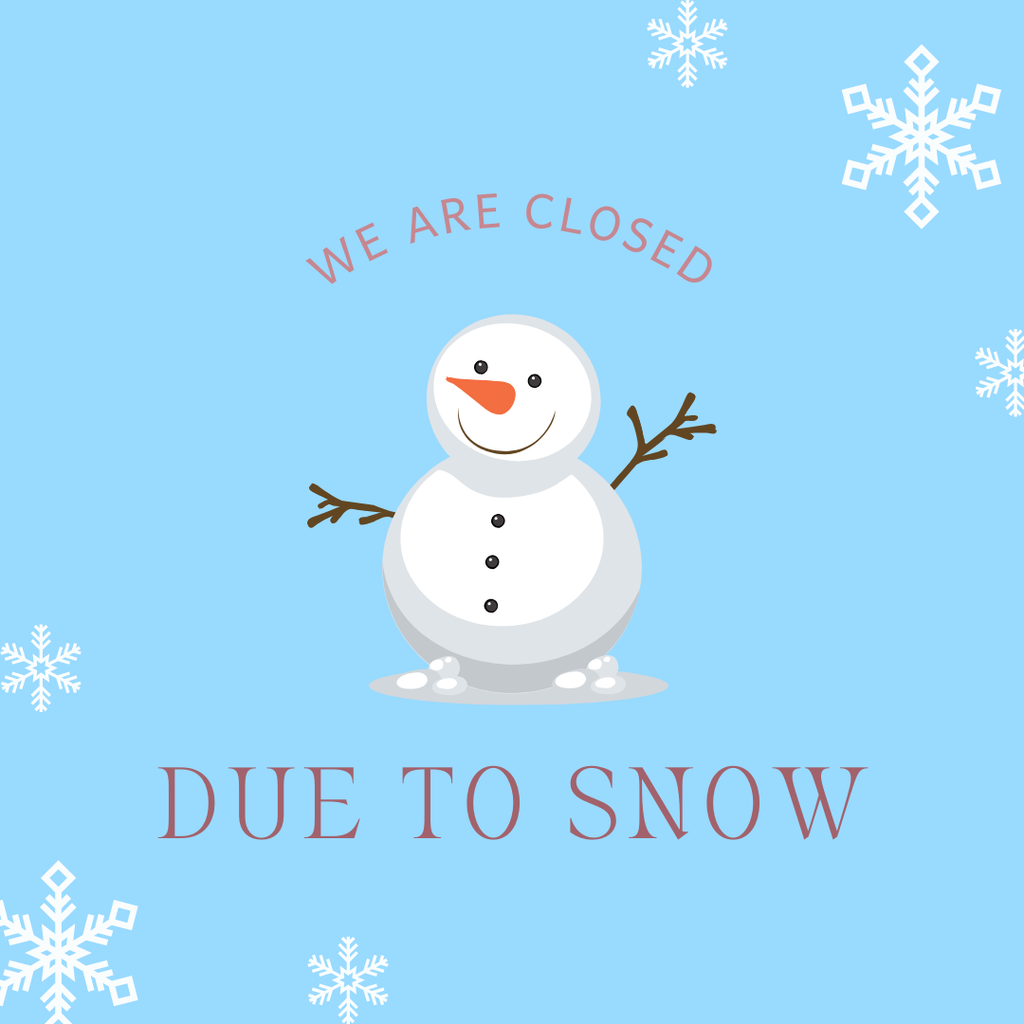 Snowman with snow in background