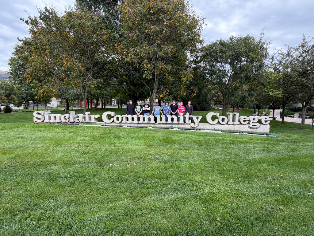 BHS Sinclair Field Trip - Students standing behind the Sinclair Sign