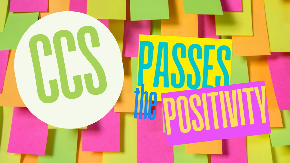 Brightly colored sticky notes with the text "CCS PASSES the POSITIVITY," promoting a positive message and uplifting environment.