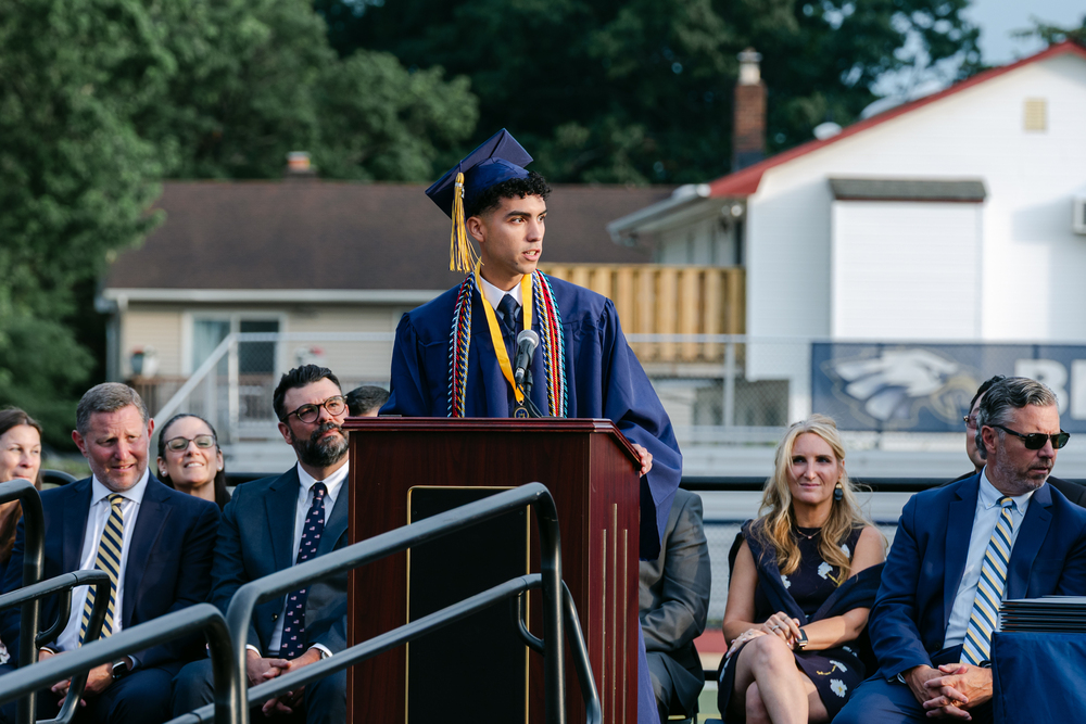 Valedictorian giving speech at podium.