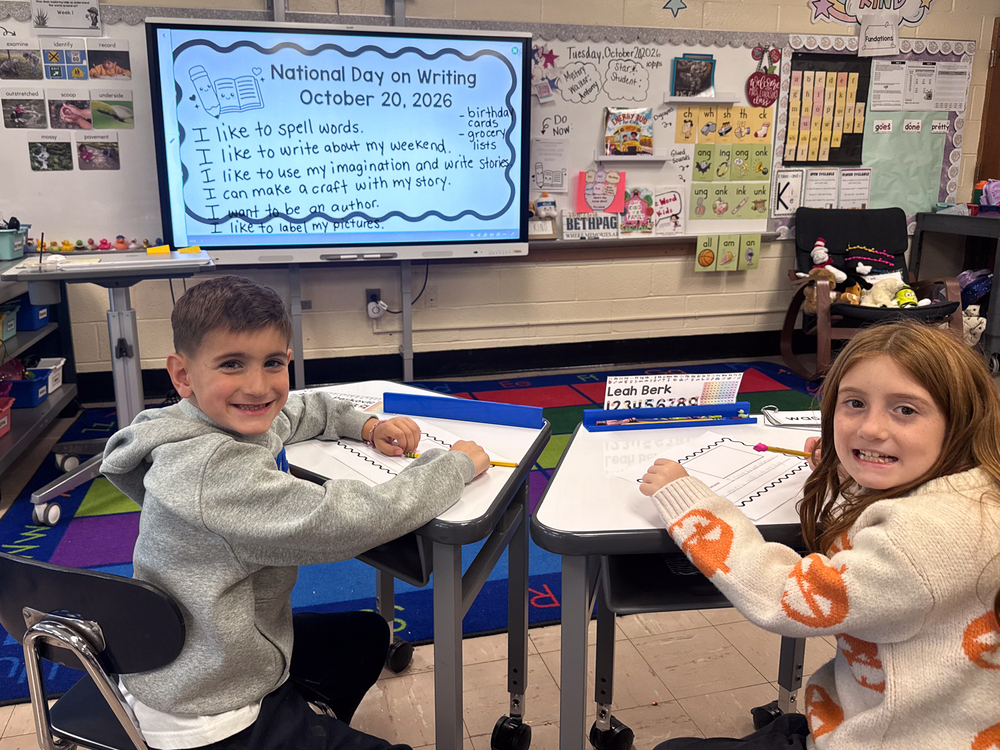 Students working together at desks.
