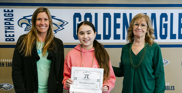 JFK Middle School students celebrate Pi Day with numbers, music, and pie