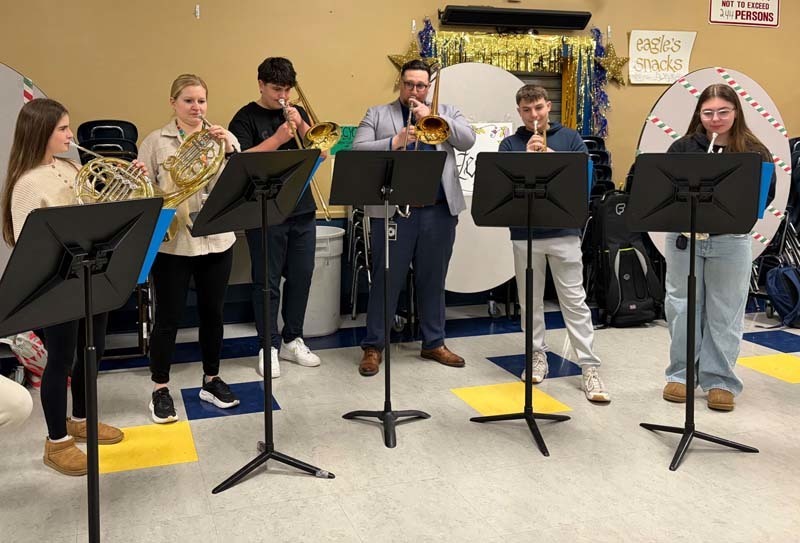 Students playing wind and brass instruments.