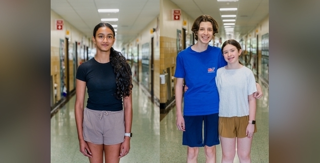 students standing in the hallway girl on left and boy and girl on right