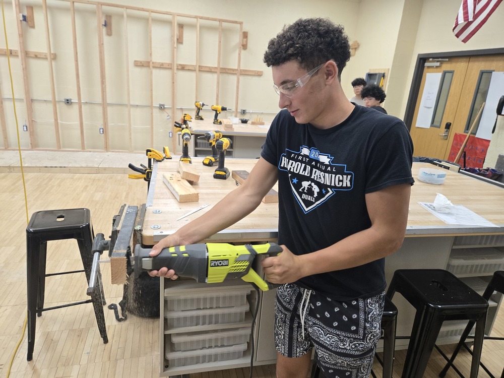 Student uses power tool during Home Improvement class at Bethpage High School.