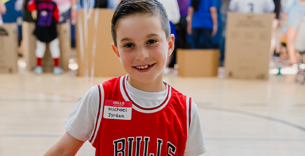Student in red jersey.