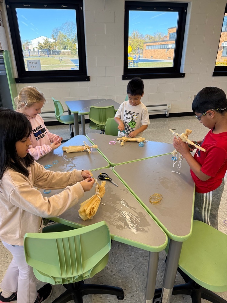 tying the ribbon on their dolls