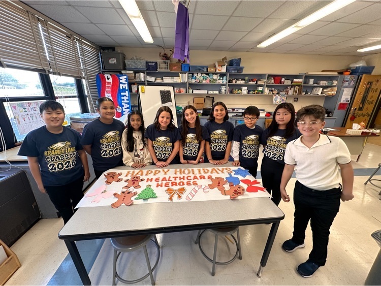 fifth graders with banner
