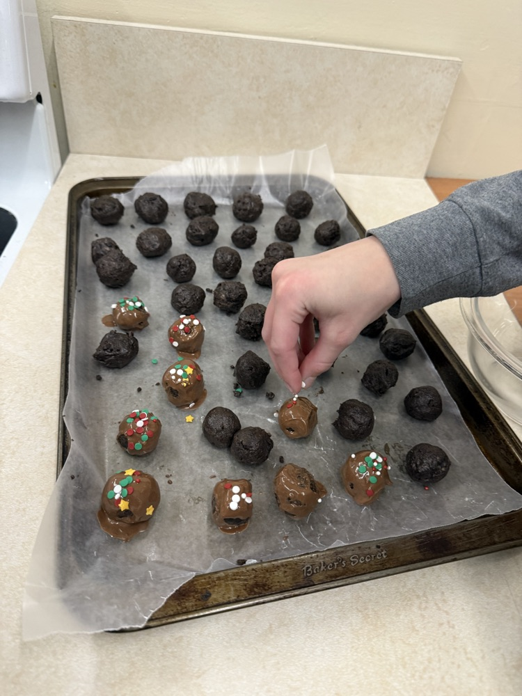 students decorating baked goods