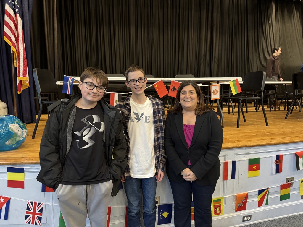 Mrs. Mastellone and her students Aiden Pace (runner up) and Jim Johnson 2026 JFK Geography Bee Champion.