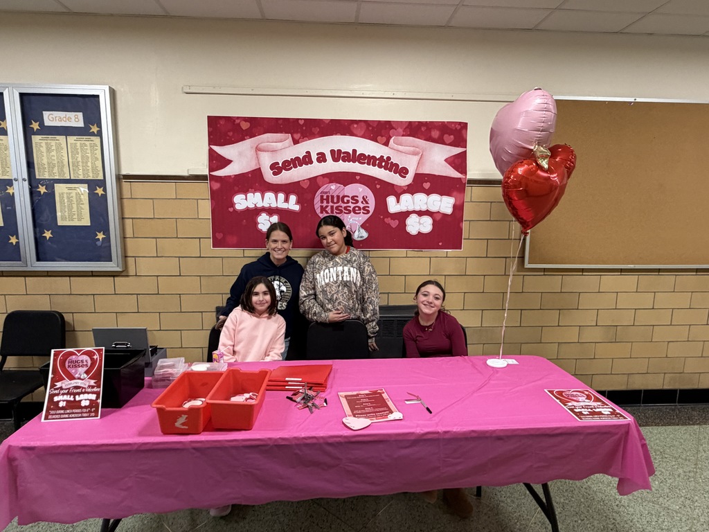 Ms. Hayes and members of the Entrepreneur Club sell Valentines during lunch periods.