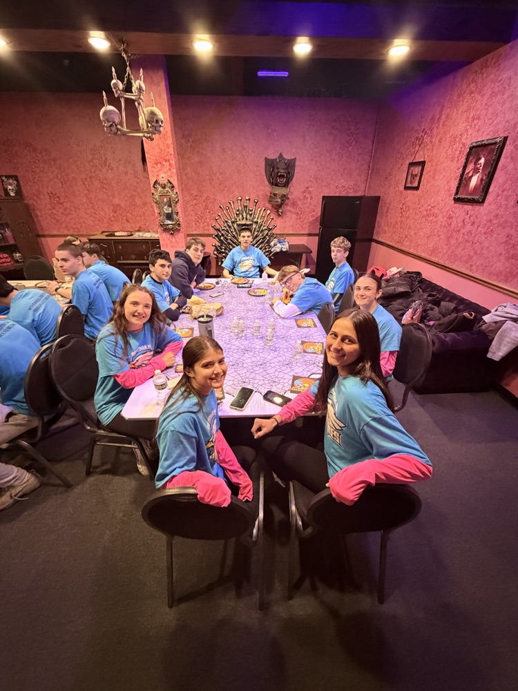 buddies sitting at a decorated table