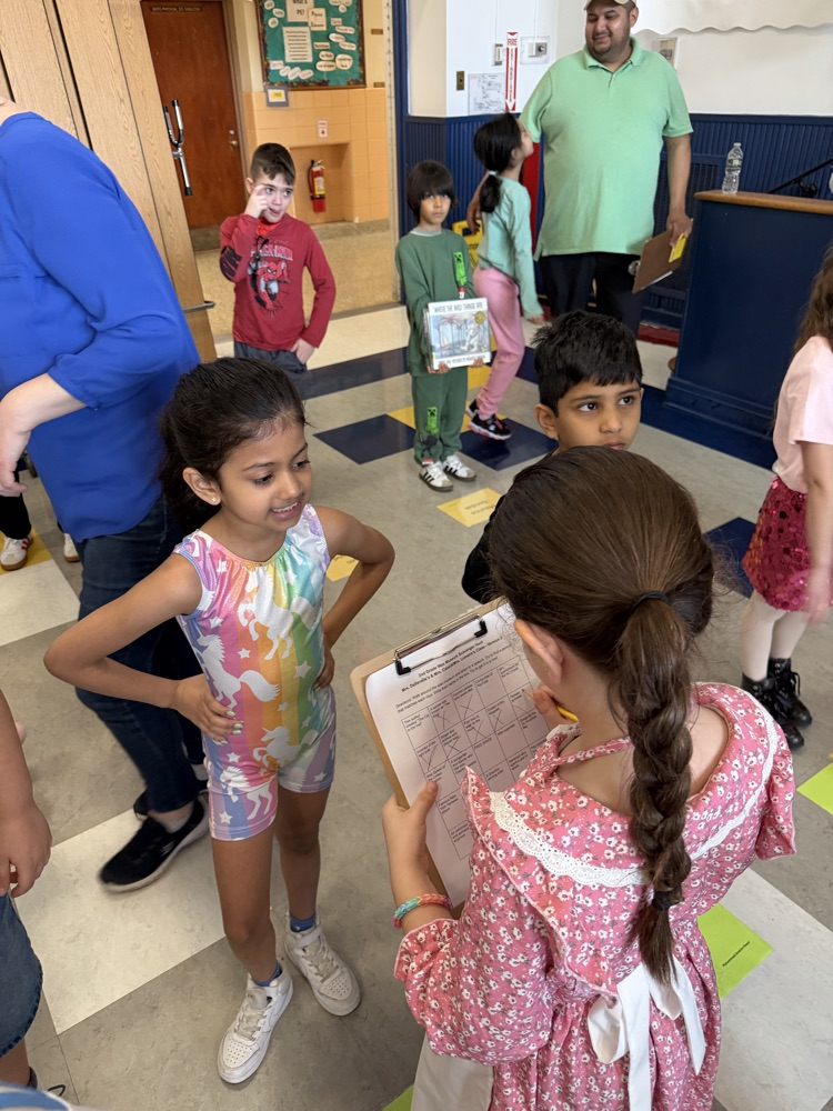 Second grade wax museum in action.