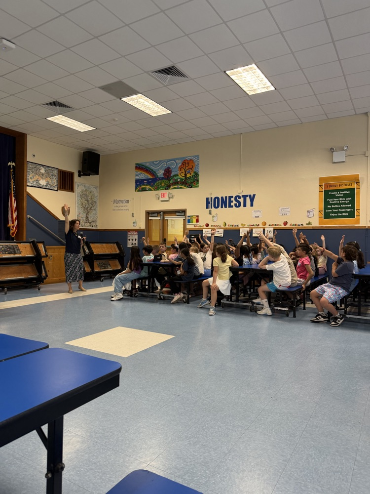 author presentation with students raising their hands