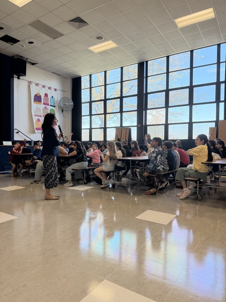 Amy McCoy author presenting to students 