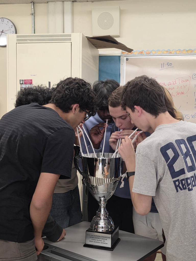 Bethpage Bytes take a "drink" from their Championship Trophy from 2025