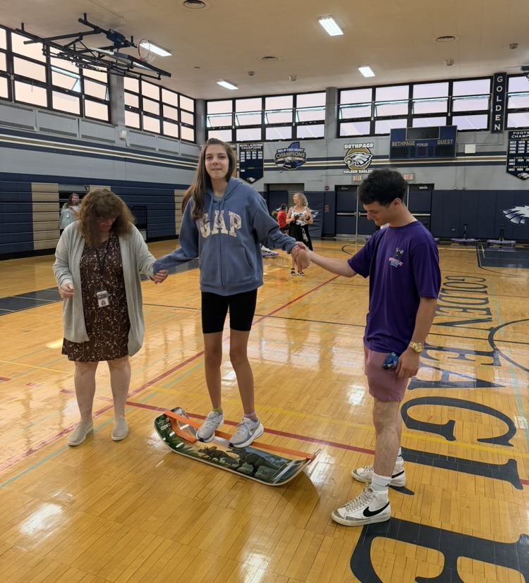 student balancing on band board