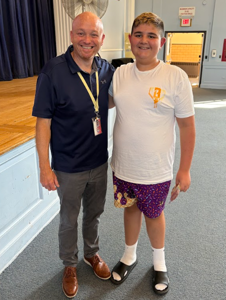 Mr. Suprenant and 7th grade assembly winner