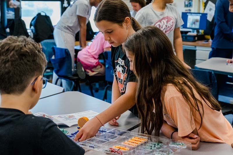 On May 20, six members of Bethpage High School’s award-winning robotics team, the Regal Eagles, visited Kramer Lane Elementary School to lead a series of engineering workshops for fifth grade students.