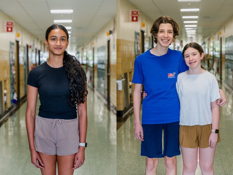 students standing in the hallway girl on left and boy and girl on right