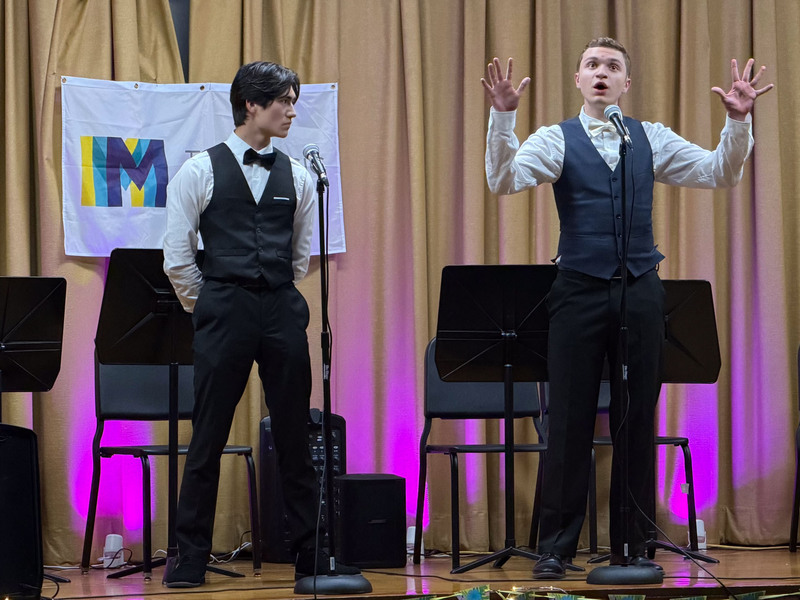 Students performing on stage.