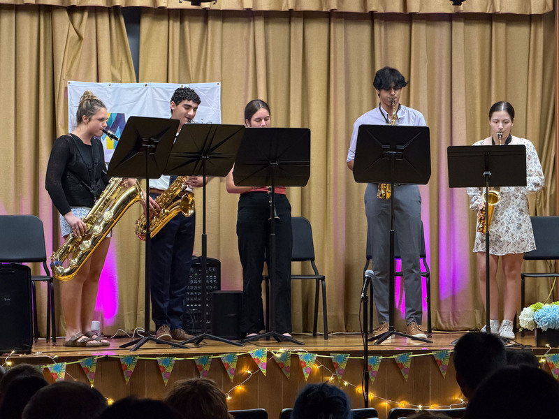 Students performing on stage.