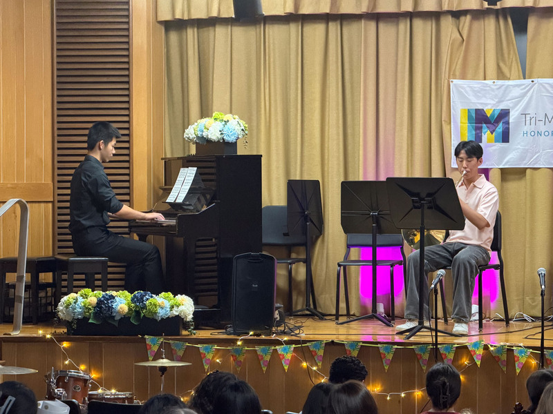 Students performing on stage.